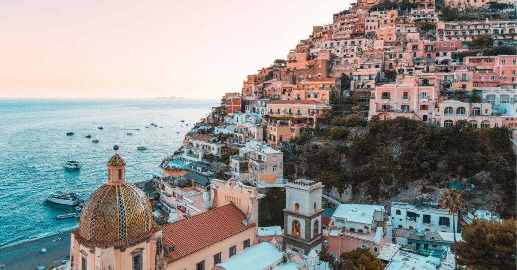Candy coloured houses on a hill by the ocean, on the Amalfi Coast.