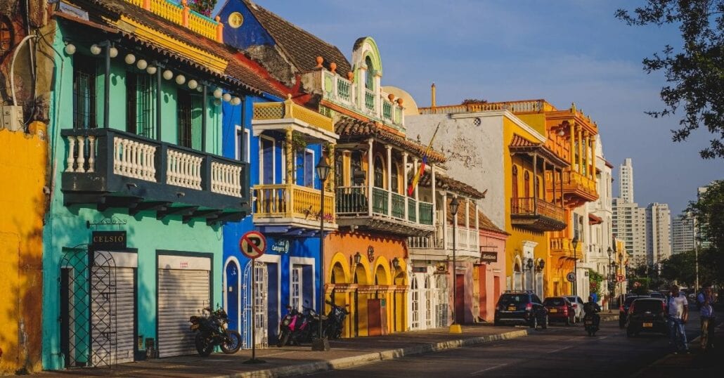 A street lined with colorful houses in Cartagena, Colombia.