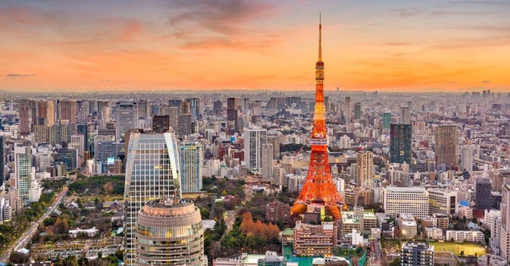 Tokyo's skyline with high rise buildings and the red Tokyo Tower.
